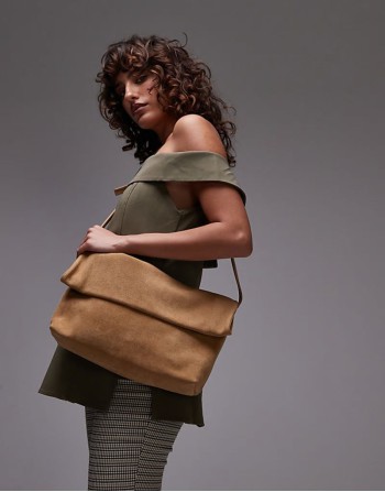 folded suede clutch grab bag with attachable shoulder strap in light neutral brown